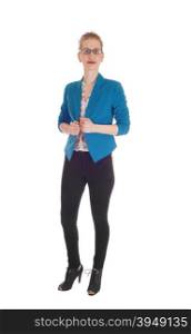 A Caucasian slim woman standing in black tights and a blue jacket withglasses isolated for white background.