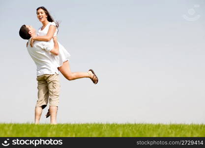 A Cheerful Couple Fooling Around On The park