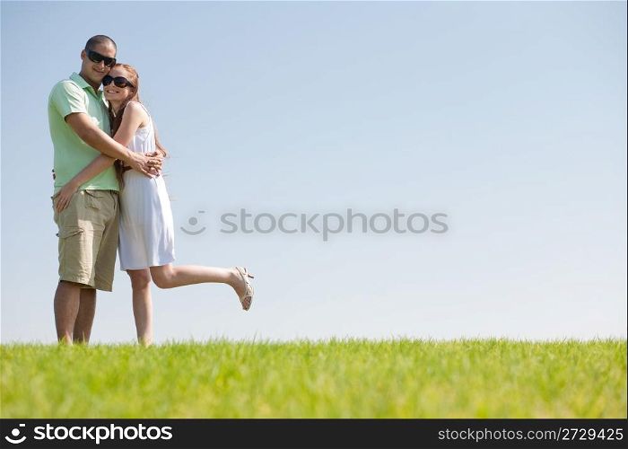A Cheerful young couple having A good time on the park