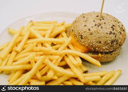 A cheeseburger and fries ideal for a children s menu