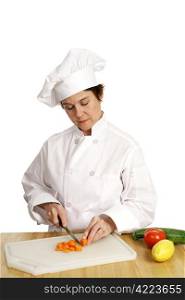 A chef busy slicing vegetables for a recipe she&rsquo;s making. Isolated on white.