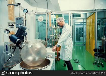 A chemist or apothecary who extracts cannabis, CBD oil, and tinctures using chemical processes. Medical cannabis product manufacturing facility. Cannabis oil extraction machine and equipment.. Apothecary extract using cannabis extraction machine in laboratory.
