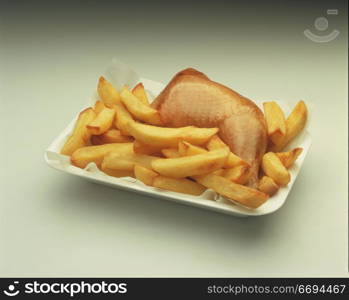 a chicken portion with fries in a takeaway tray