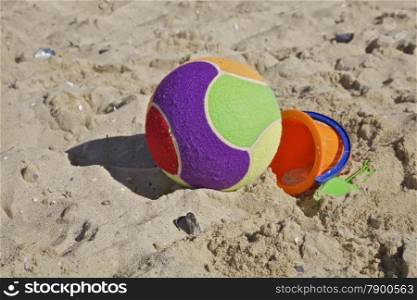 A Child&rsquo;s Beach Bucket and Ball on the Sand