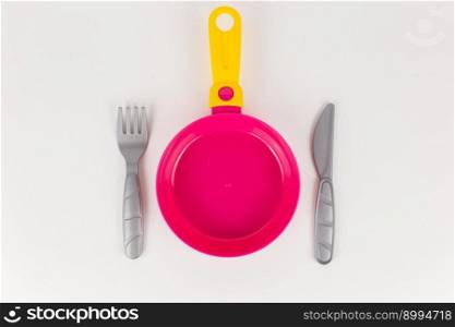 a children&rsquo;s toy plastic frying pan on a white background. children&rsquo;s toy plastic frying pan on a white background