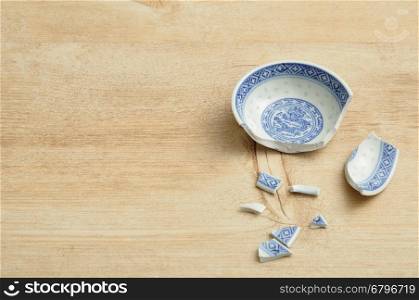 A Chinese bowl broken into pieces