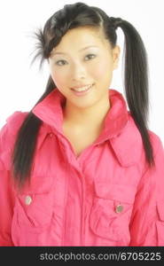 A chinese model poses in fashionable clothing in the studio.