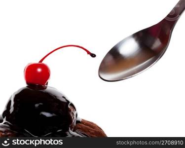 A chocolate covered sundae with a red cherry, ready to eat. Shot on white background.