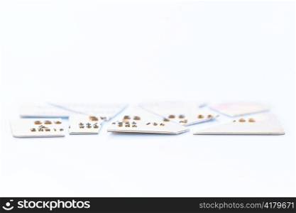 a chopped-up credit card lying on a white background. symbolic photo for debt.