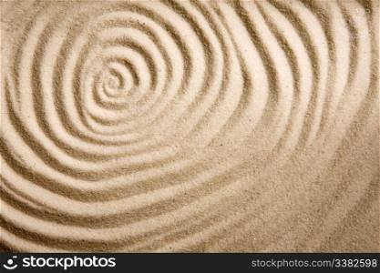 A circular sand swirl background texture abstract