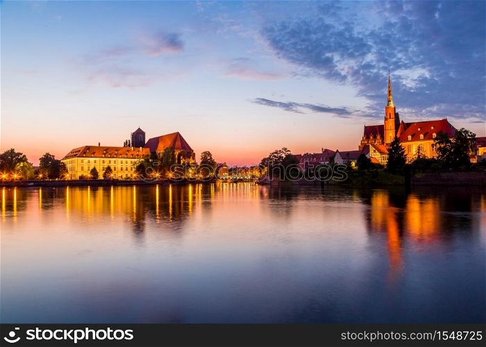A cityscape cathedral, river Odra. Wroclaw, Poland, at dusk
