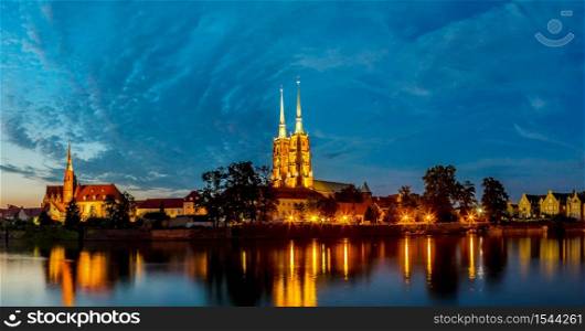 A cityscape cathedral, river Odra. Wroclaw, Poland, at dusk. Panorama.