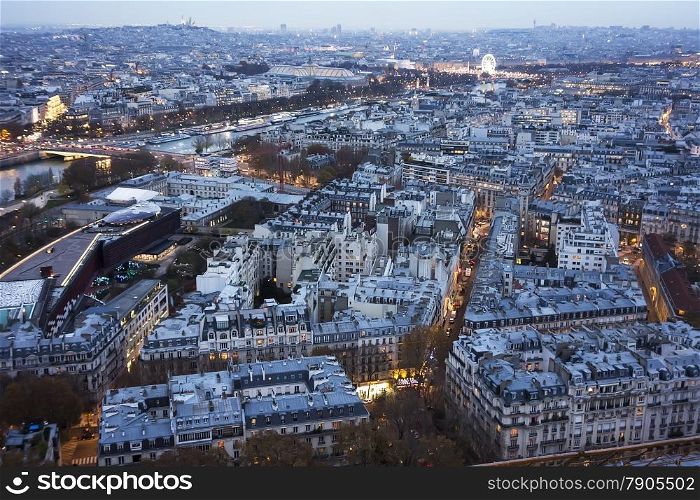 A cityscape of Paris looking from the Eiffel Tower over the Seine River towards the Crystal Palace and the Louvre.