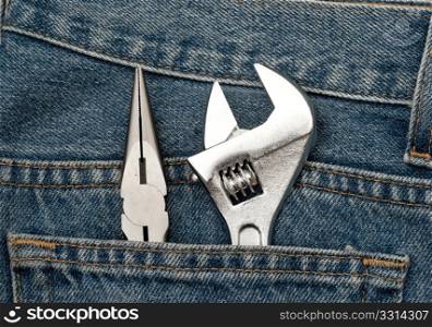 a clean blue jeans with wrench in the back pocket