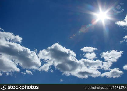 A clear sky at noon, the sun is in the frame