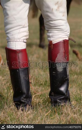 A close up a person in riding boots