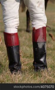 A close up a person in riding boots