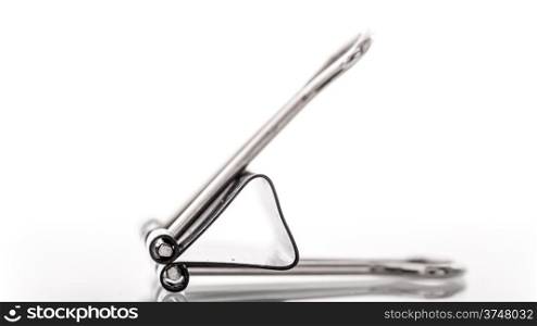 A close up image of a binder clip on a white background