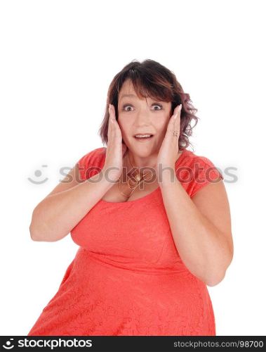 A close-up image of a frightened woman holding her hands on her facewith her mouth and eyes open, isolated for white background