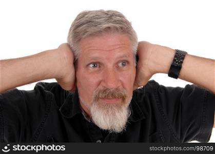 A close up image of a middle age man with gray hair and beard holding his hands over his ears, isolated for white background