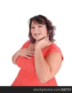 A close-up image of an plus size woman in a red dress with her hand on her face, isolated for white background