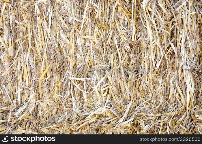 A close up of a bale of straw