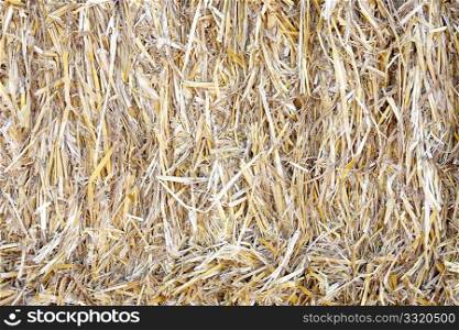 A close up of a bale of straw
