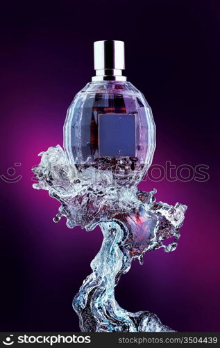 A close-up of a designer s perfume bottle on the crest of the wave.