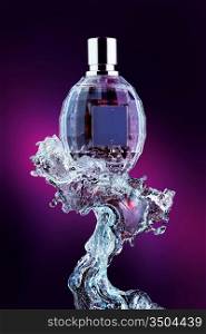 A close-up of a designer s perfume bottle on the crest of the wave.