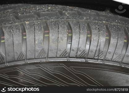 a close up of a new car tire