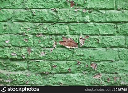 a close-up of an old aged green colored brickwall
