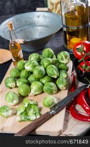 a close-up of Brussels sprouts on wooden plate