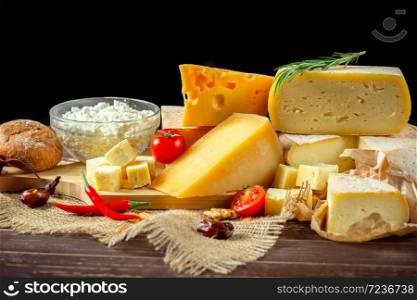 A close up of cheeseboard with different kinds of cheese for an appetizer