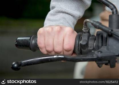 a close up of hand on handlebar