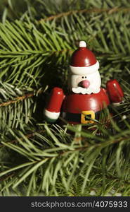 A close up of Santa Claus&acute; toy on christmas tree