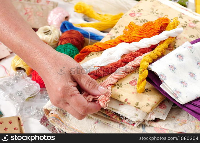 a close-up of the hands of a seamstress