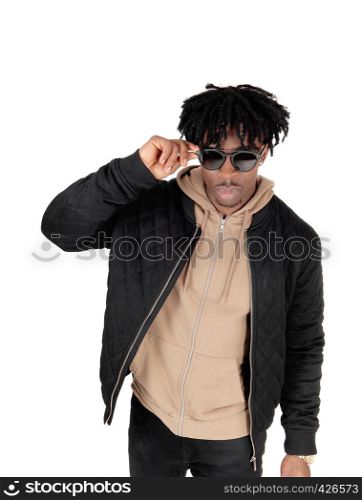 A close up portrait picture of an African American man is casual clothing putting on his sunglasses, isolated for white background