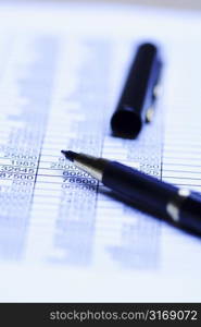 A close up shot of a spreadsheet and a pen, can be used for accounting concept ( shallow DOF)