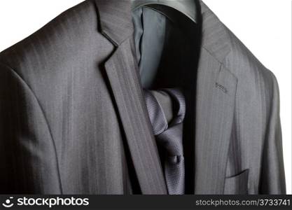 A close-up shot of an elegant formal mens suit with a tie