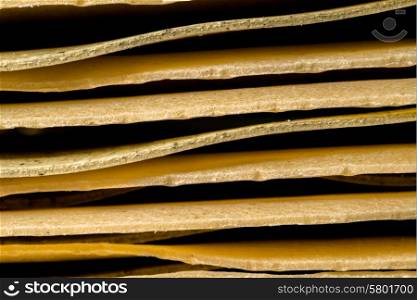 A close up view of stacked pieces of lasagna pasta.