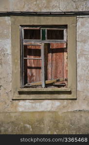 A closed old window with dirty glass.