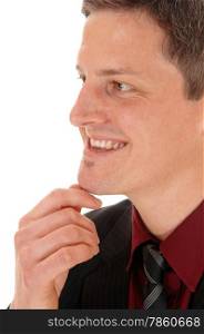 A closeup face shoot of a young smiling man in a burgundy shirt, isolatedfor white background.