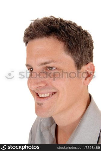 A closeup head shoot of a happy smiling young man, isolated forwhite background.
