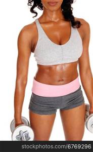 A closeup image of a slim african american girl in sportswear holding twodumbbell&rsquo;s showing her flat tummy, isolated for white background.