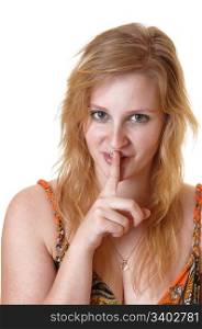 A closeup of a pretty, blond teenager girl with one finger over her mouthtells people be quiet, for white background.