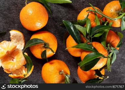 a closeup of delicious tangerines with leaves