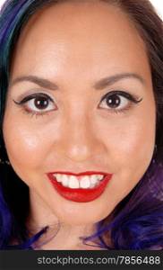 A closeup picture of a beautiful Asian&rsquo;s woman&rsquo;s face with big eye&rsquo;s and red lips.