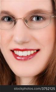 A closeup picture of a beautiful young woman with glasses, blue eye&rsquo;s and red lips.