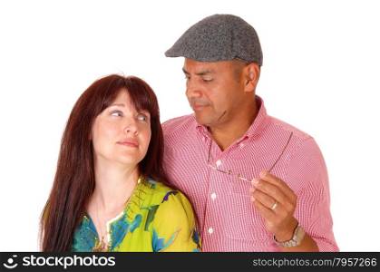A closeup picture of a middle age couple standing insolate for whitebackground looking at each other.