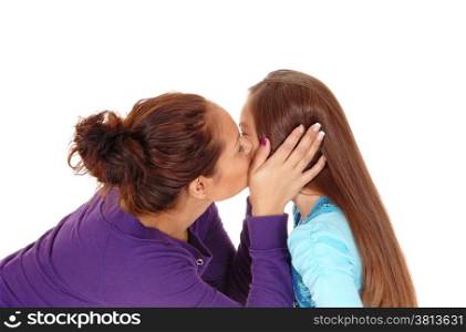 A closeup picture of a mother kissing her little daughter on the chick,isolated for white background.